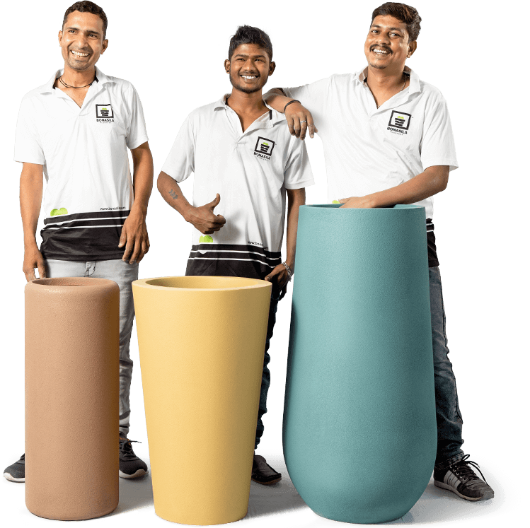 three people standing with bonasila planters in smiling faces